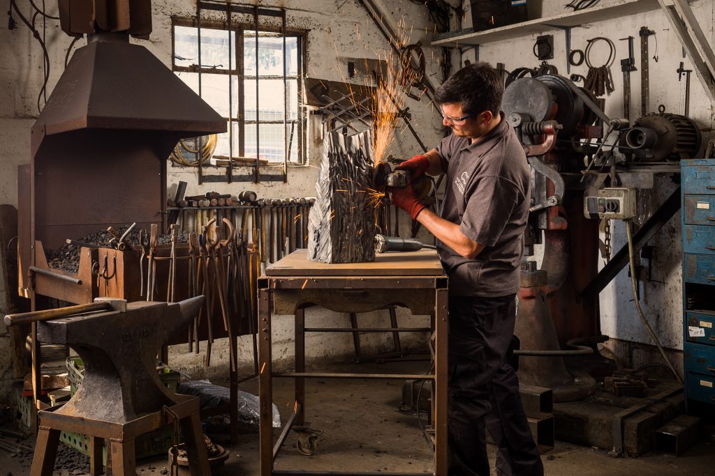 Blacksmith Will Barker in his forge, photographed for Lexus.